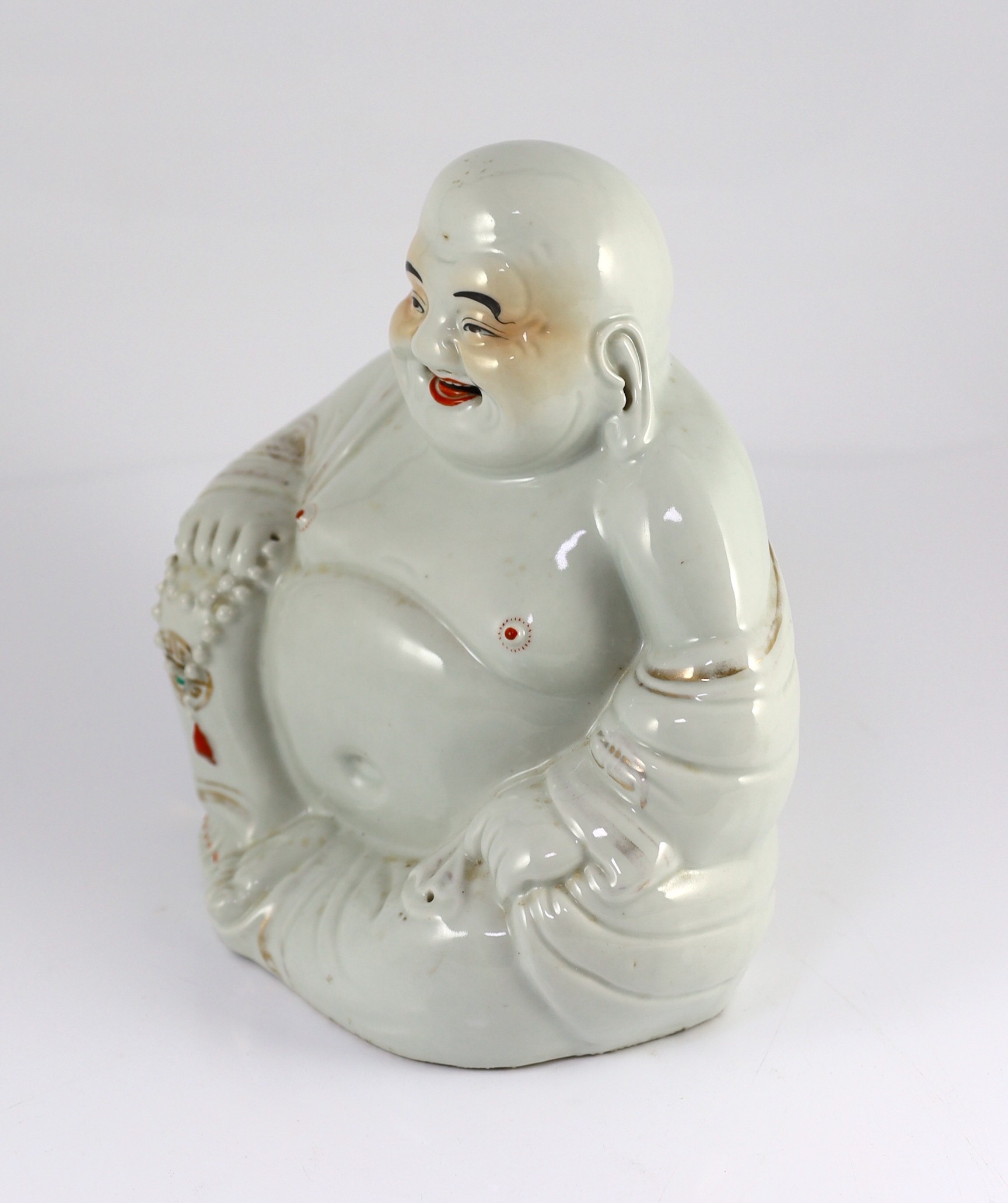 A Chinese porcelain figure of Budai, Republic period, 25cm high, wear to gilding